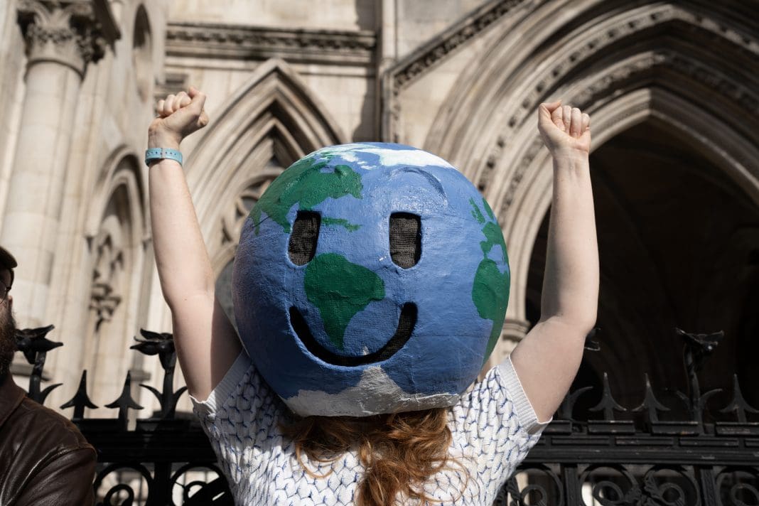 Woman celebrating the landmark victory, quashing the Cumbrian coal mine