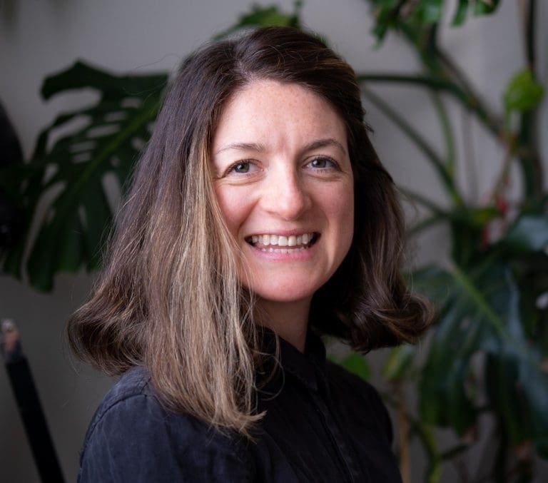 A headshot of Catherine Manning, programme director of MeasureUp, smiling at the camera