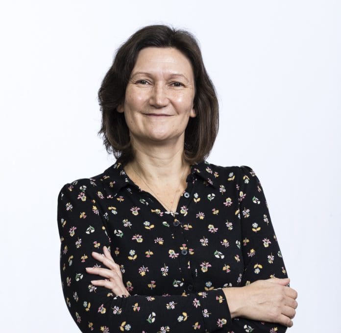 A professional headshot of Amanda Williams of the Chartered Institute of Building facing the camera, smiling with her arms folded