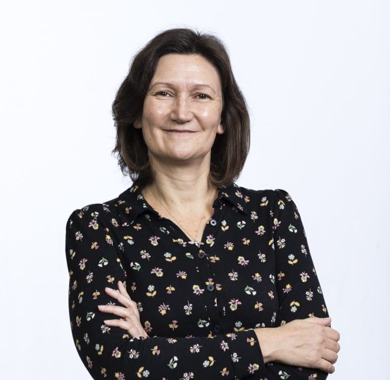 A professional headshot of Amanda Williams of the Chartered Institute of Building facing the camera, smiling with her arms folded