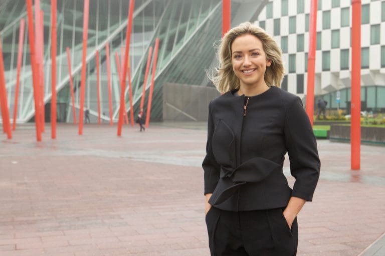 A picture of Lisa Duignan, data centre sector lead for Europe at Turner & Townsend, smiling at the camera with her hands in her pockets.