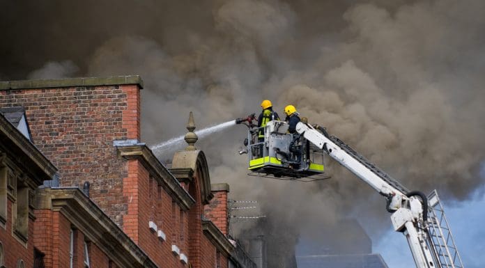 UK firefighters in action, reminiscent of the action that would have taken place at the Richmond House fire