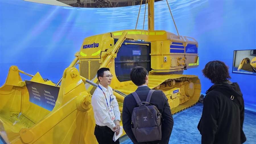 A Komatsu employee explains the company’s vision for underwater construction of the future at CES 2025 in Las Vegas. (Photo: Business Wire)