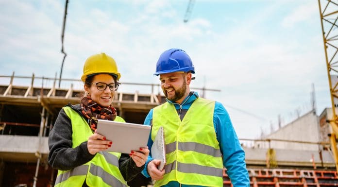 Construction workers Using Digital Tablet on a construction site