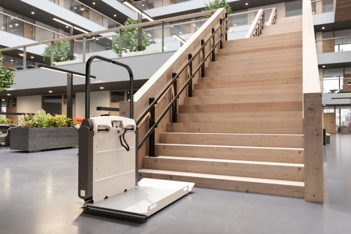 Disability Stair Lift At Office Staircase For Disabled People, representing the need for access audits