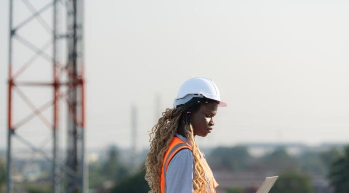 Engineer working on a building site The telephone and internet network signal systems of the construction building are being inspected representing the appropriate limit of indemnity for your business' cyber insurance policy