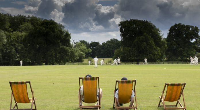 watching a cricket match on a typical English cricket ground in summer, representing changing influence of statutory consultees on planning decisions